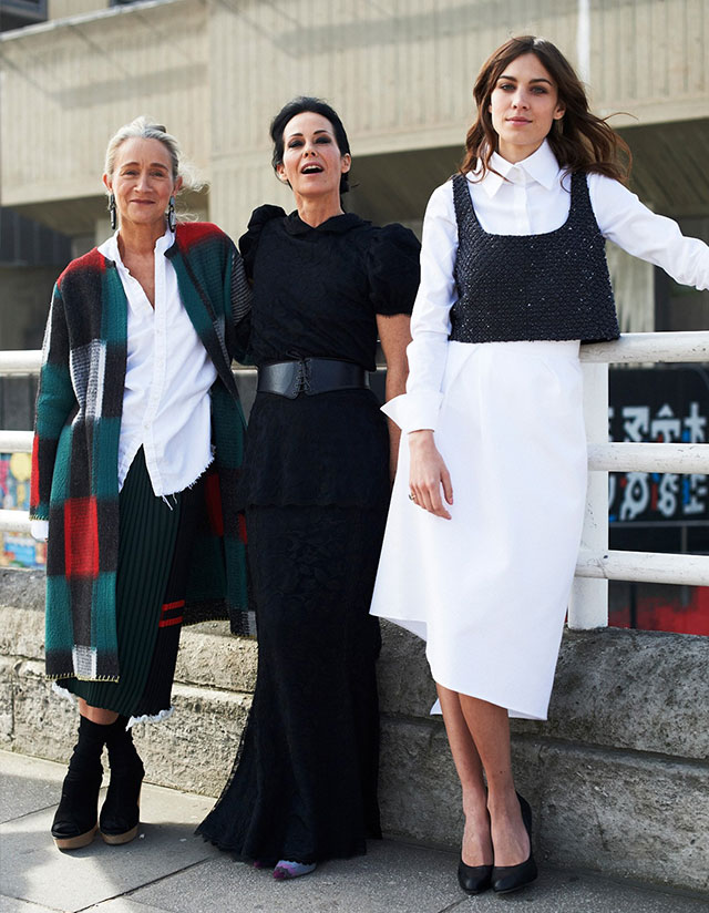 Alex Chung poses with guest outside vogue fest